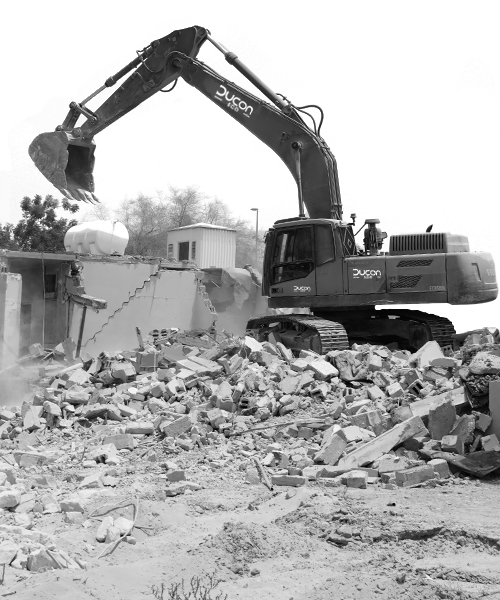 Demolition excavator at work