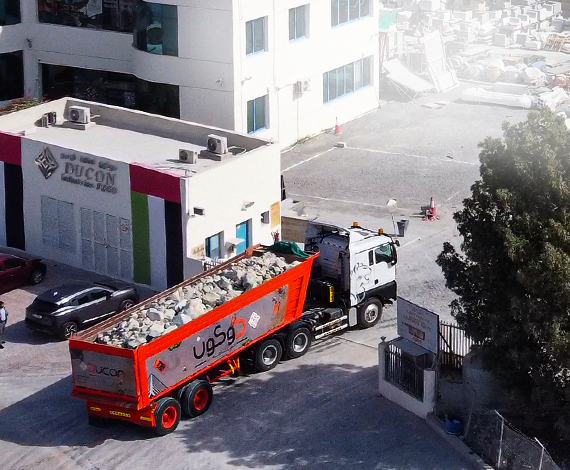 Ducon waste collection truck at residential building